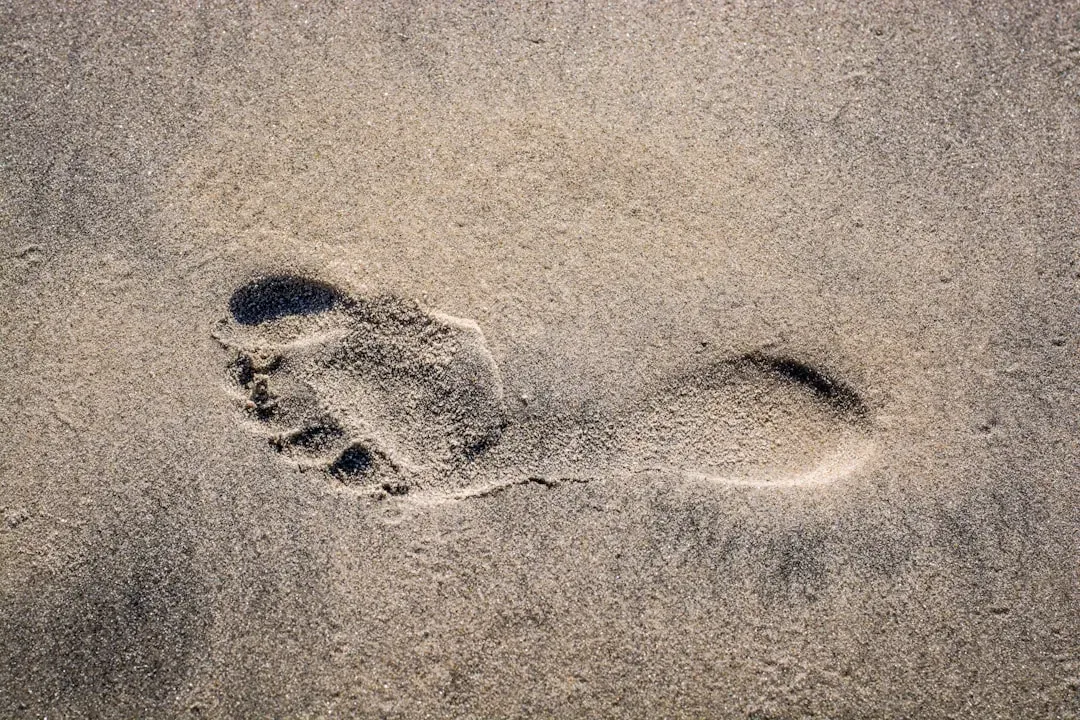 Footprints In The Sand That Should Not Exist (Image Credits: Unsplash)