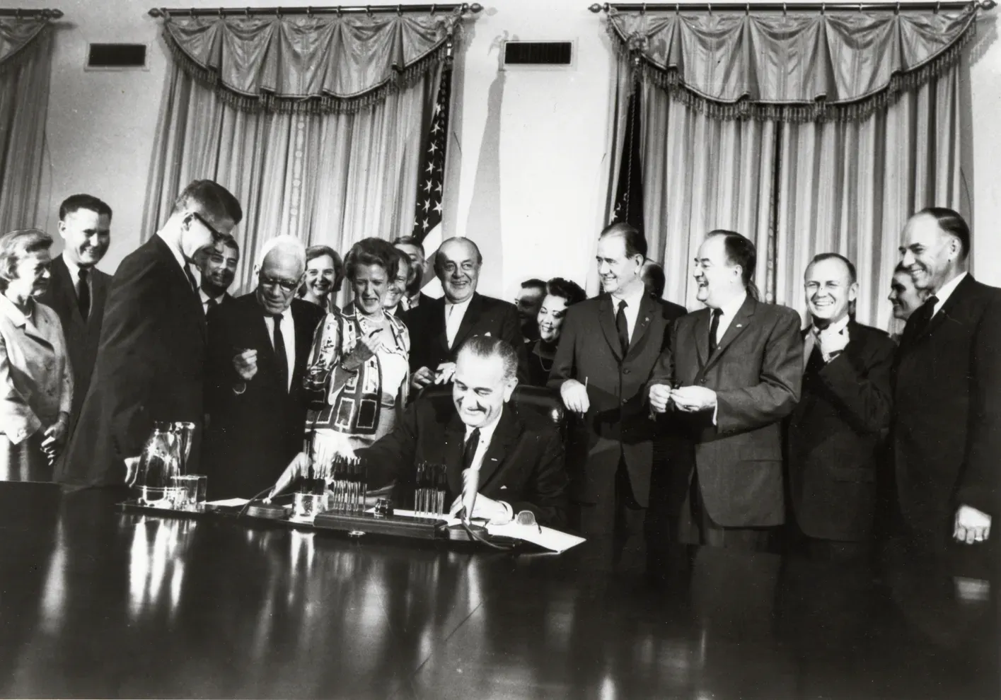 #10 - A Sitting President Personally Signed the Response (President Johnson signing the Food Stamp Act of 1964, CC BY 2.0)