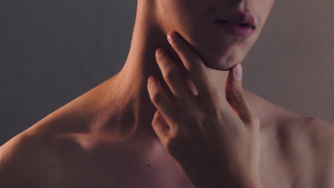 They Touch Their Neck or Collarbone Area (Image Credits: Unsplash)