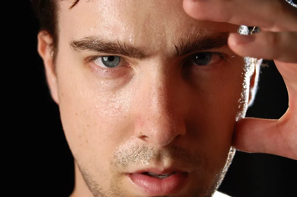 The Physical Manifestations of Sweating and Color Changes (Image Credits: Flickr)