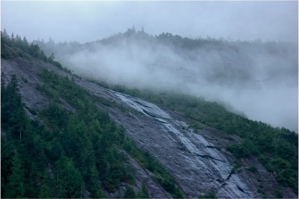 Pisces: Cloud-Wrapped Peaks, Waterfalls, and Dreamy Valleys (markbyzewski, Flickr, CC BY 2.0)