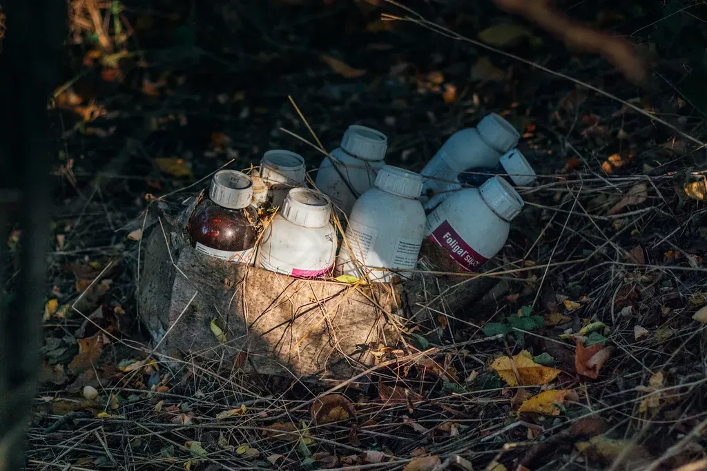#6 Chemical Legacies: Pesticide Bottles and Contaminated Soil (Ivan Radic, Flickr, CC BY 2.0)