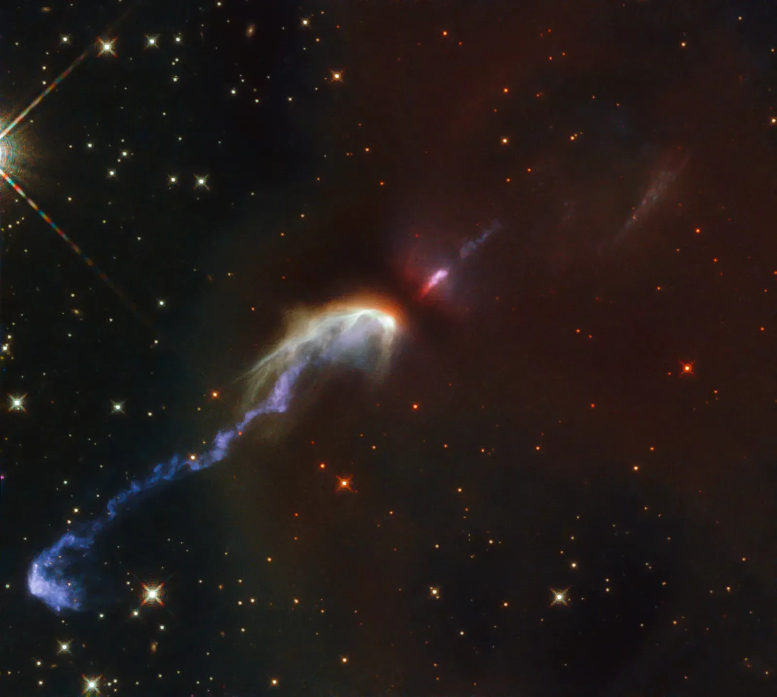 The Birth of a Star at the Center (By ESA/Hubble & NASA, B. Nisini, Public domain)