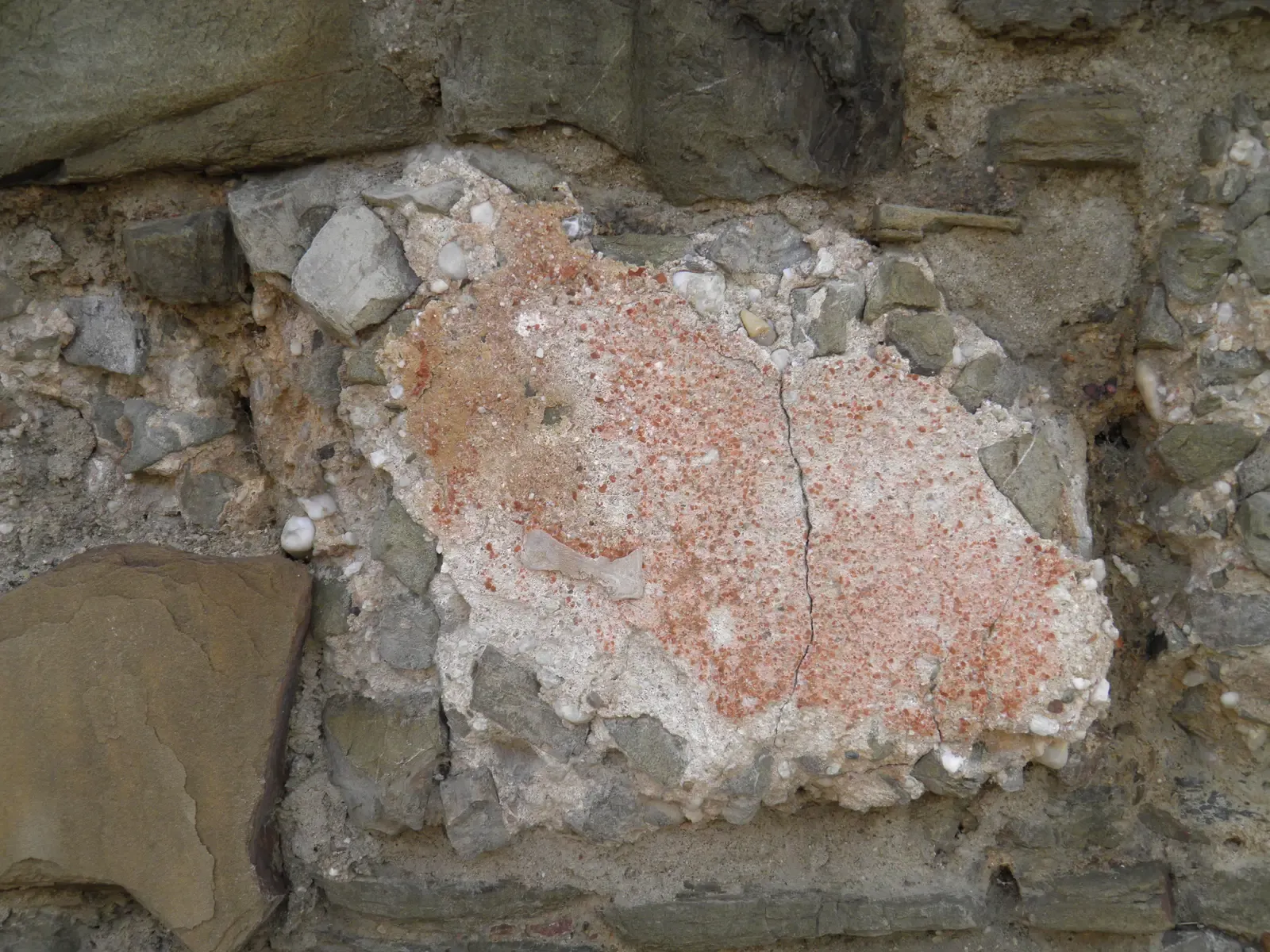 #1 - Roman Concrete That Heals Its Own Cracks (Roman concrete with reddish plaster in the wall at Rheinbach, Eifel Aqueduct, GermanyUploaded by Marcus Cyron, CC BY-SA 2.0)