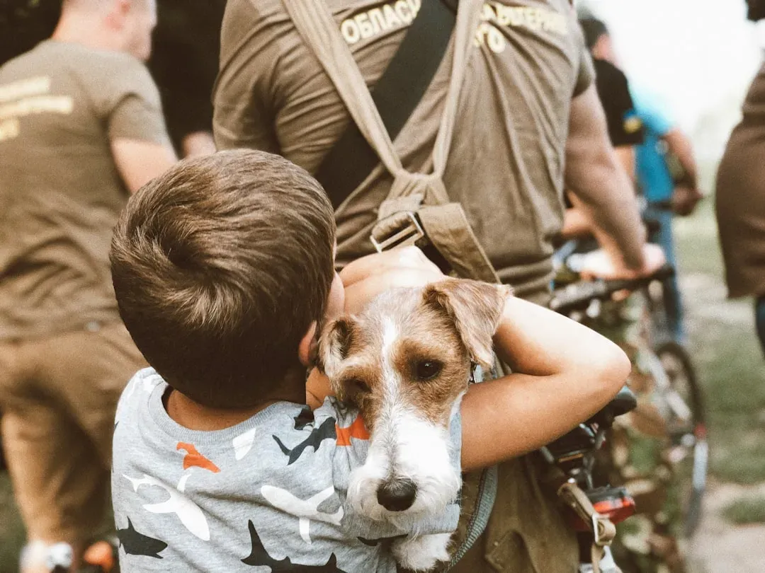 #7 - Letting Kids Climb, Hug, and "Ride" the Dog (Image Credits: Unsplash)
