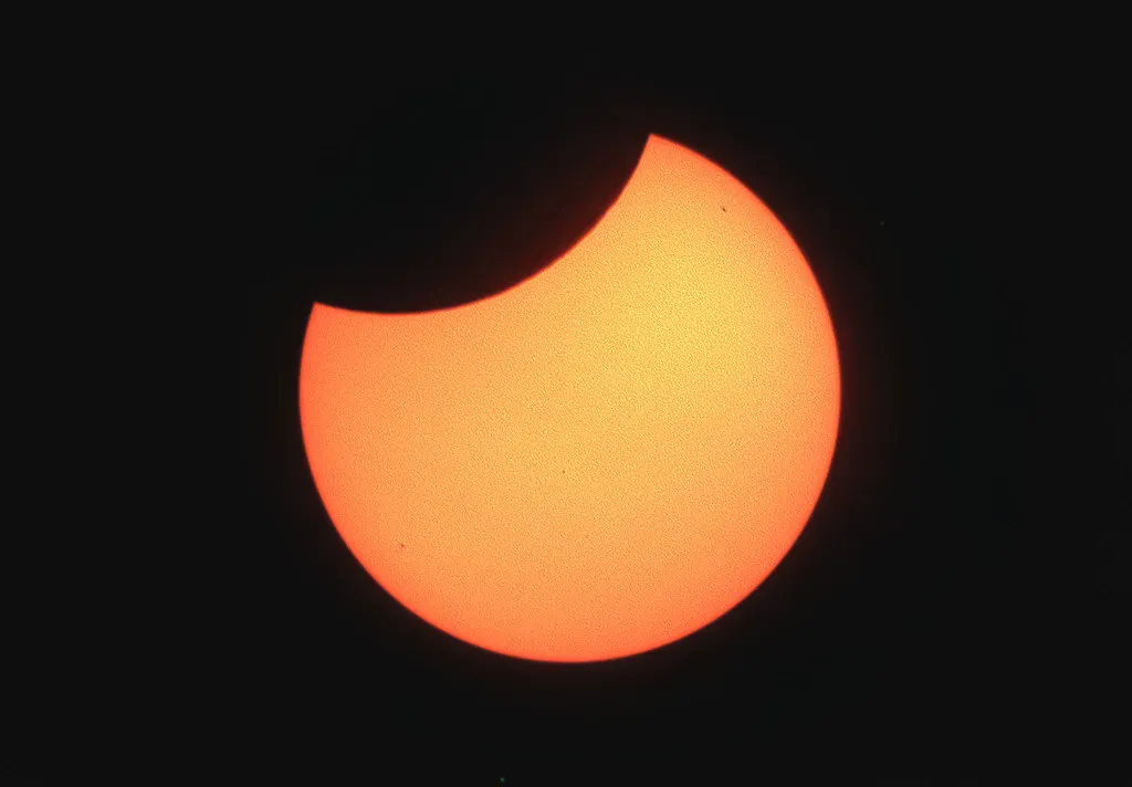 A Partial Solar Eclipse That Bites a Chunk Out of the Sun (Image Credits: Flickr)