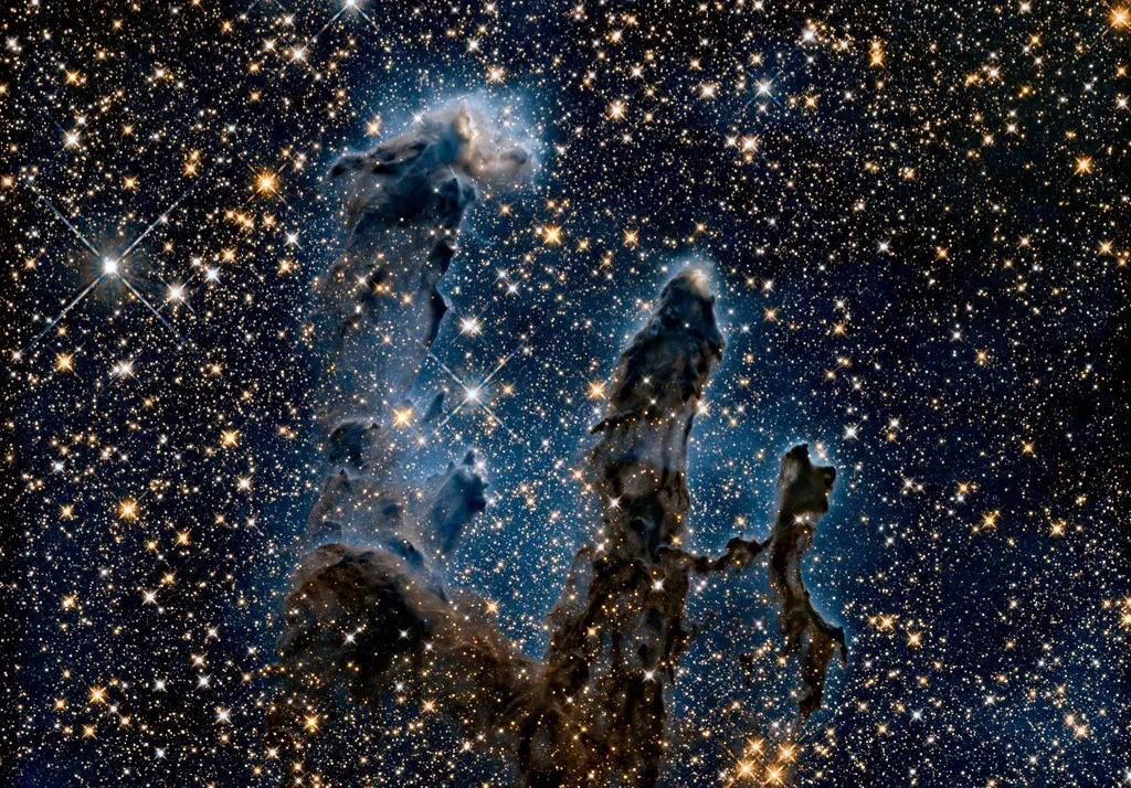 1. Baby Stars Being Born in the Pillars of Creation (Image Credits: Flickr)