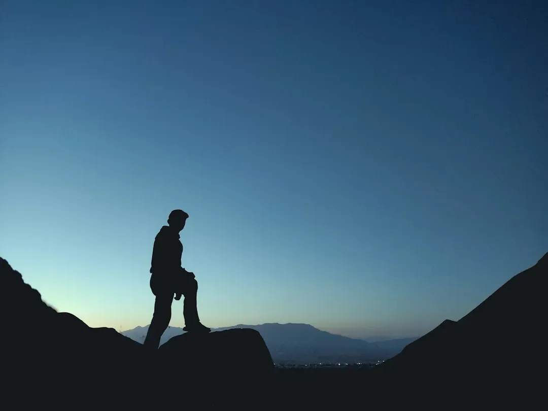 #9 - The Lone Explorer Silhouette Against the Setting Sun (Image Credits: Unsplash)