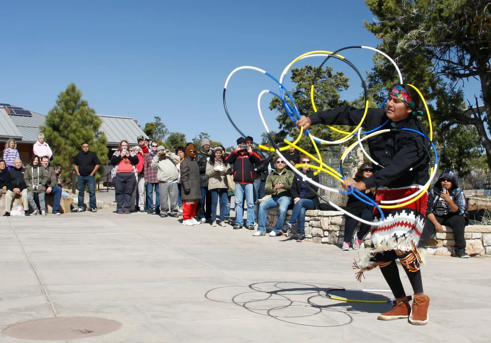 The Living Sacred: Native Tribes and Their Unbroken Connection (Grand Canyon Archaeology Day 2013 Hoop Dance 328, Public domain)