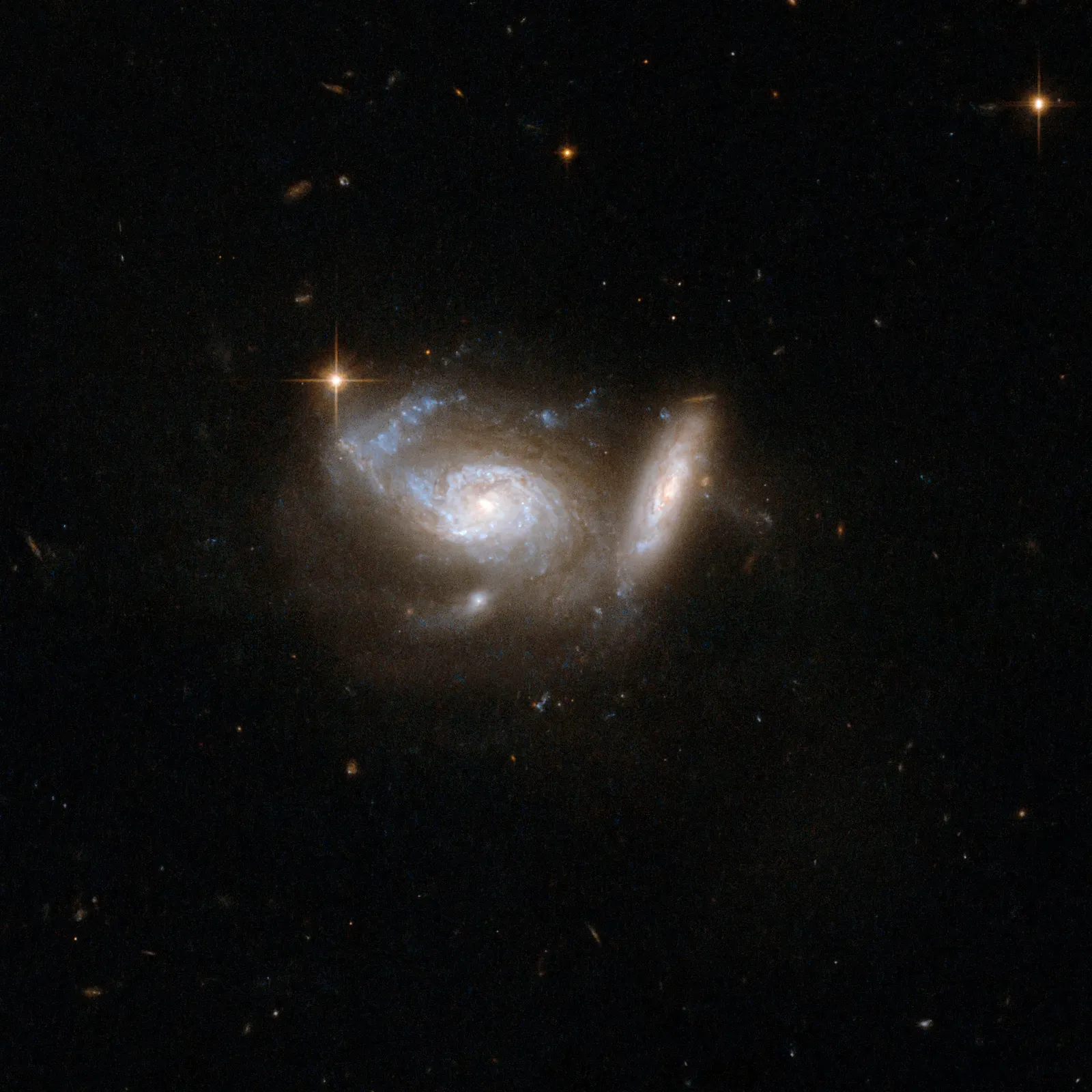 The Quiet Role of Dark Matter When Galaxies Pass Through Each Other (By NASA, ESA, the Hubble Heritage (STScI/AURA)-ESA/Hubble Collaboration, and A. Evans (University of Virginia, Charlottesville/NRAO/Stony Brook University), Public domain)