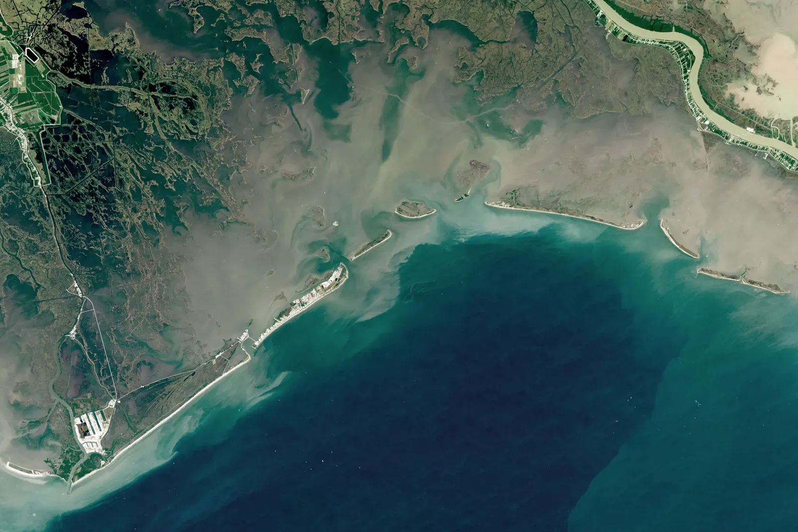 #3 Louisianaβs Vanishing Marsh Coast β The Gulfβs Slow Drowning Frontier (By NASA Earth Observatory images by Lauren Dauphin, using Landsat data from the U.S. Geological Survey. Story by Adam Voiland., Public domain)
