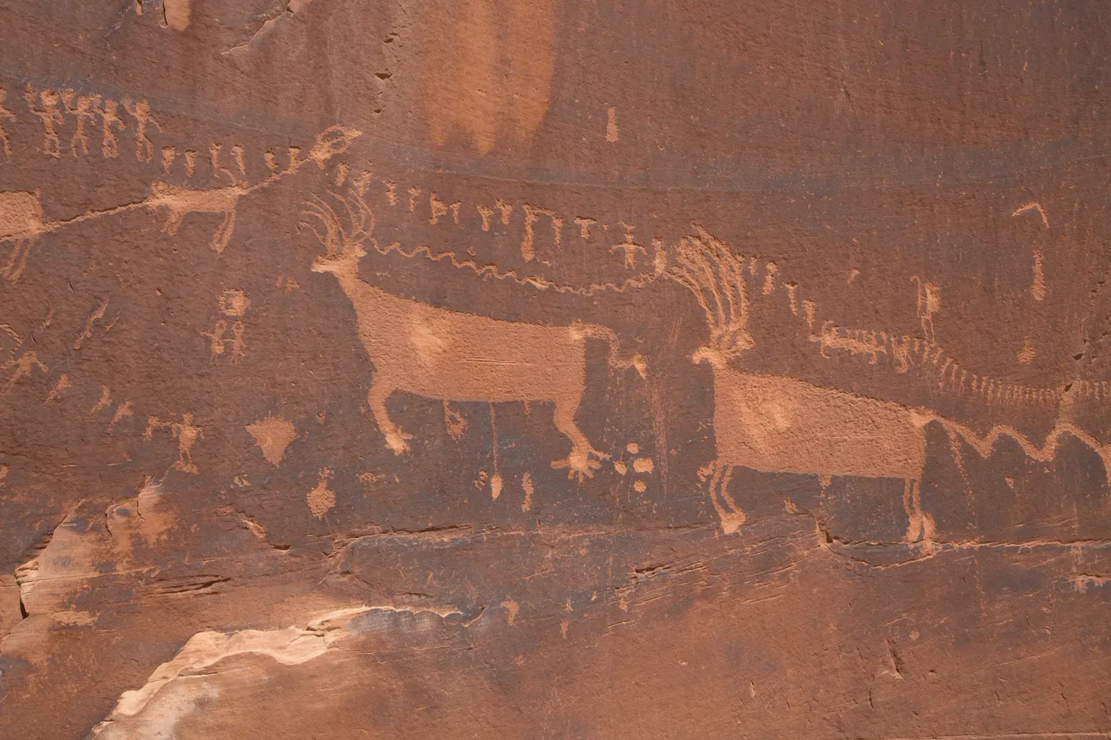 Art on Stone Walls: Petroglyphs and Pictographs (Petroglyphs on a southwest facing cliff, Public domain)
