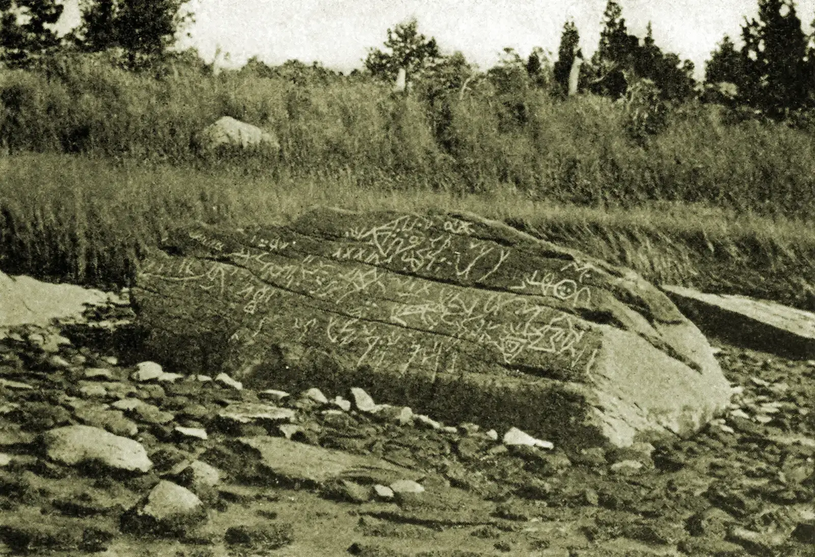 4. Dighton Rock: Covered in Symbols No One Has Ever Decoded (Recent history of Dighton Rock by Edmund Burke Delabarre, 1919. Reprinted from the publications of The Colonial Society of Massachusetts, Volume XX Other sources: U.S. History Images, slide 3888, Publications of The Colonial Society of Massachusetts, Volume XX, TRANSACTIONS 1917–1919., Public domain)