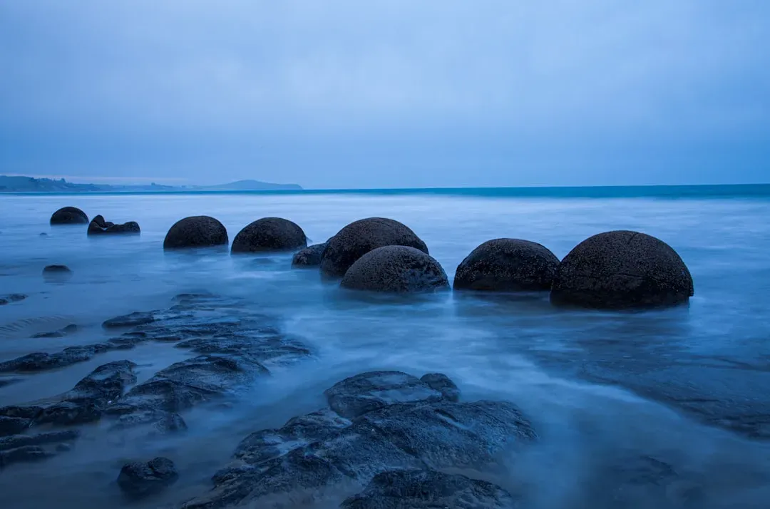 The Moeraki Boulders: Perfect Spheres Rolling Out of the Cliffs (Image Credits: Unsplash)