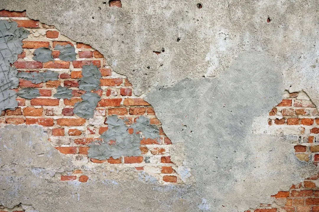 #14 - Sudden Debris, Small Stone Fragments, or Dust Appearing Below the Wall (Image Credits: Unsplash)