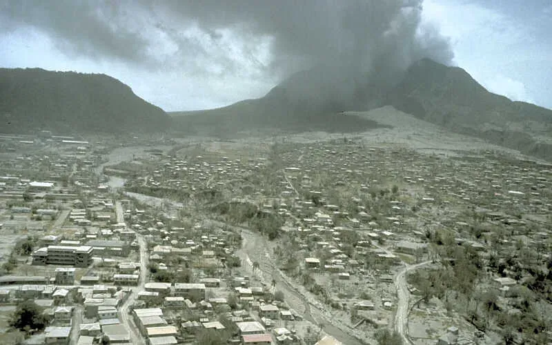 #8 - Plymouth, Montserrat: Dinners Lost Under Volcanic Ash (By R.P. Hoblitt, Public domain)