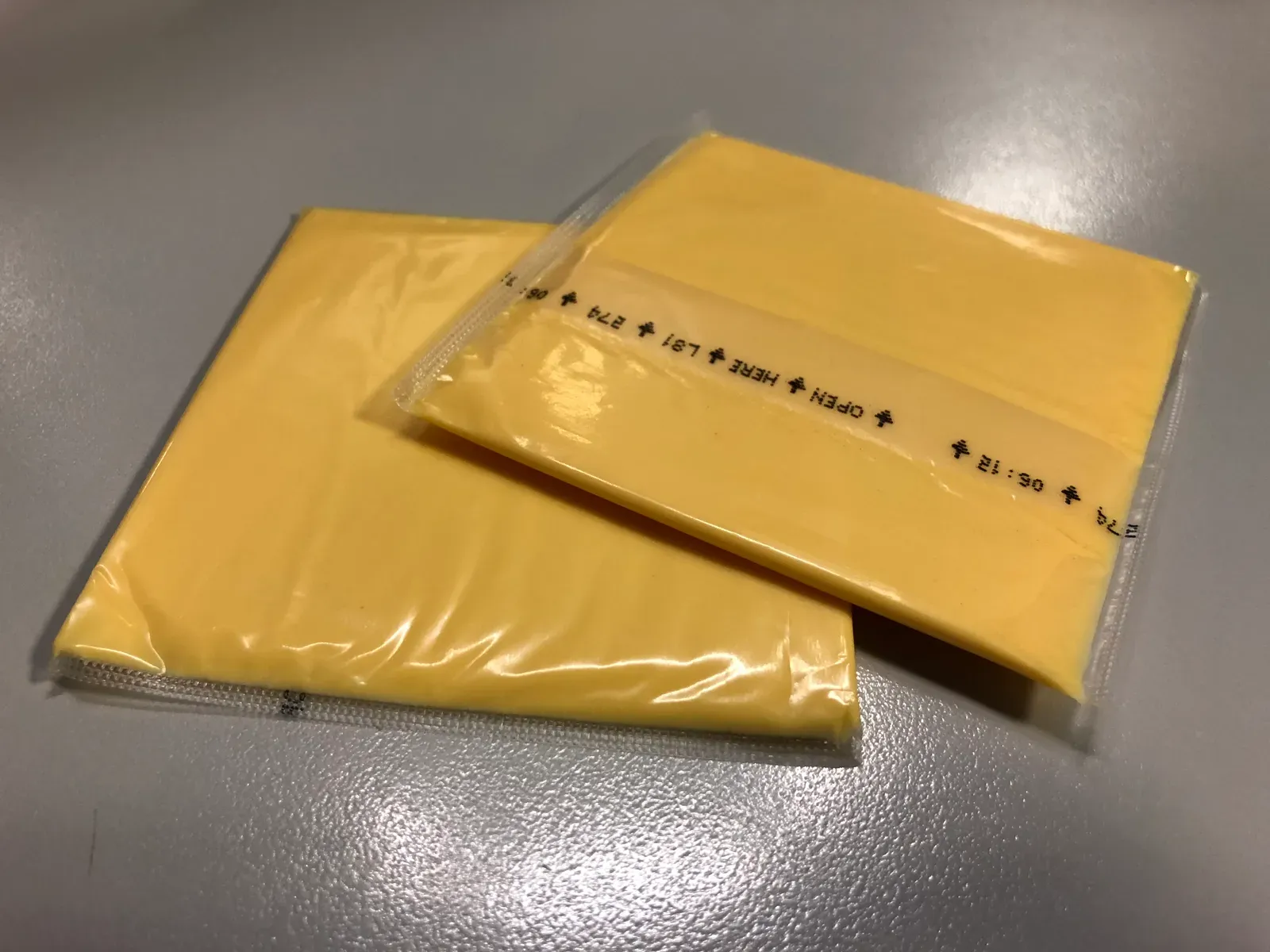 9. Individually Wrapped Processed Cheese Slices Left on the Counter (Image Credits: Wikimedia)
