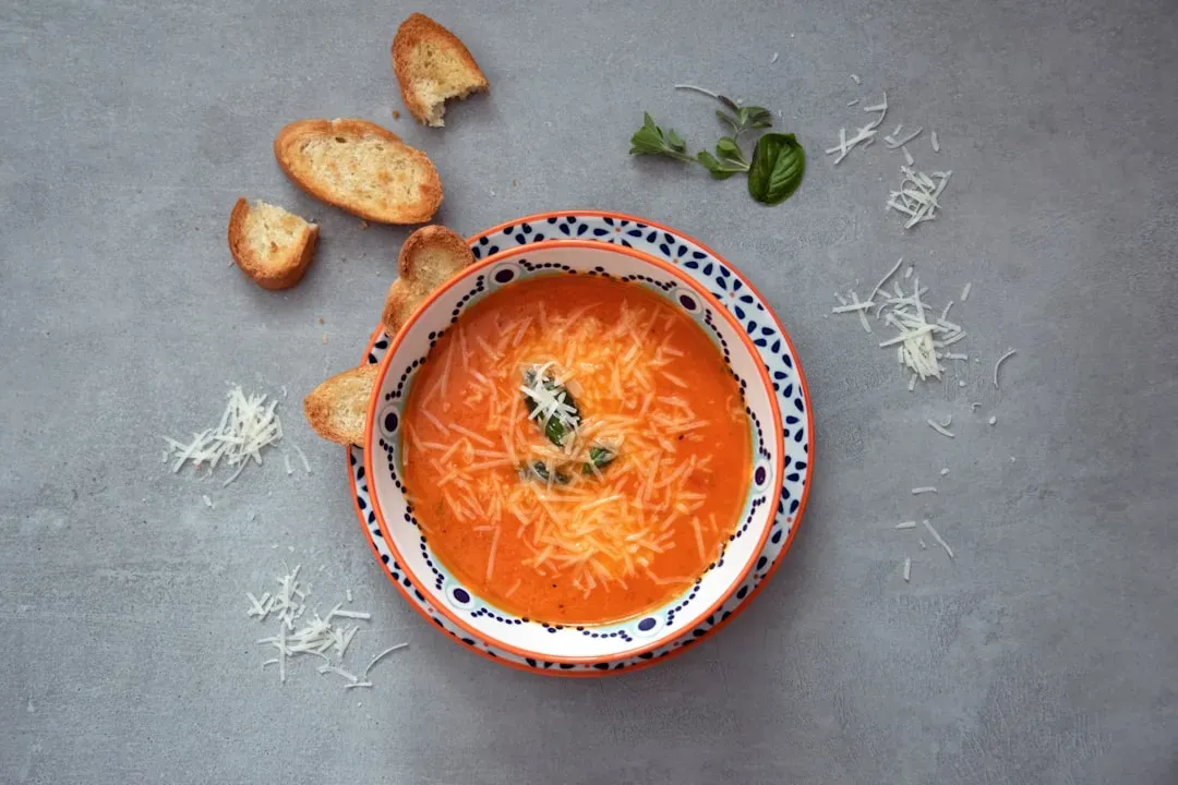 Creamy tomato soup with grilled cheese (Image Credits: Unsplash)