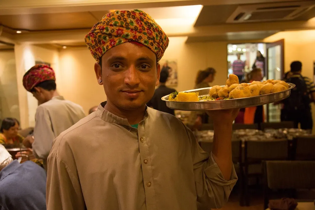 3. Interrupting Staff While They're With Another Table (Image Credits: Pixabay)