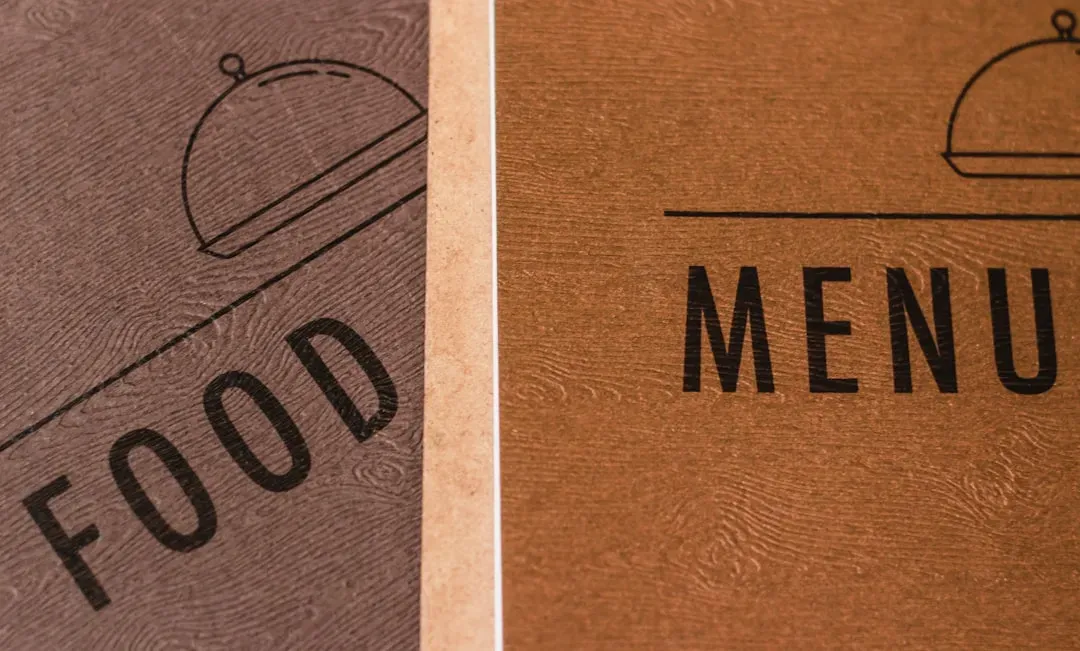 3. Sticky, Stained, or Worn-Out Menus (Image Credits: Unsplash)