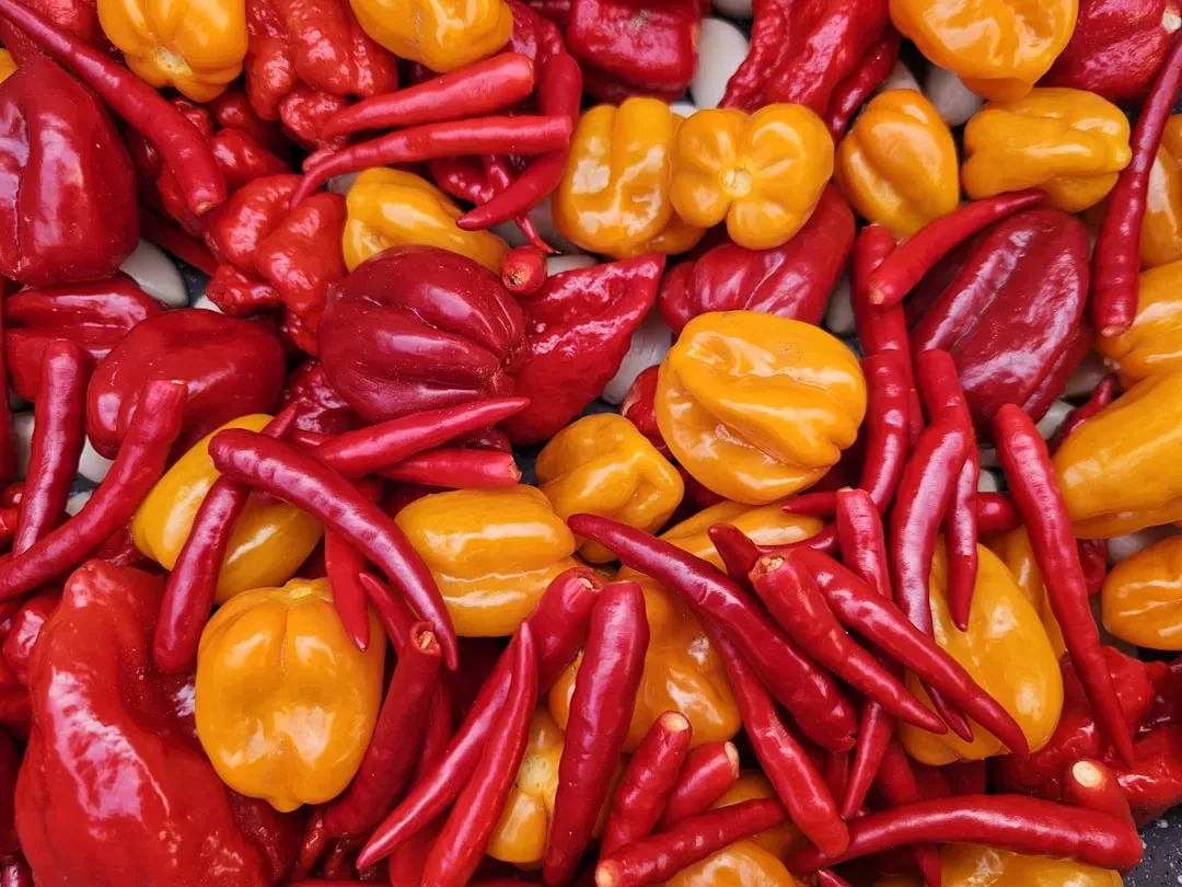 Aries: Hot Sauce and Spicy Peppers (Image Credits: Unsplash)