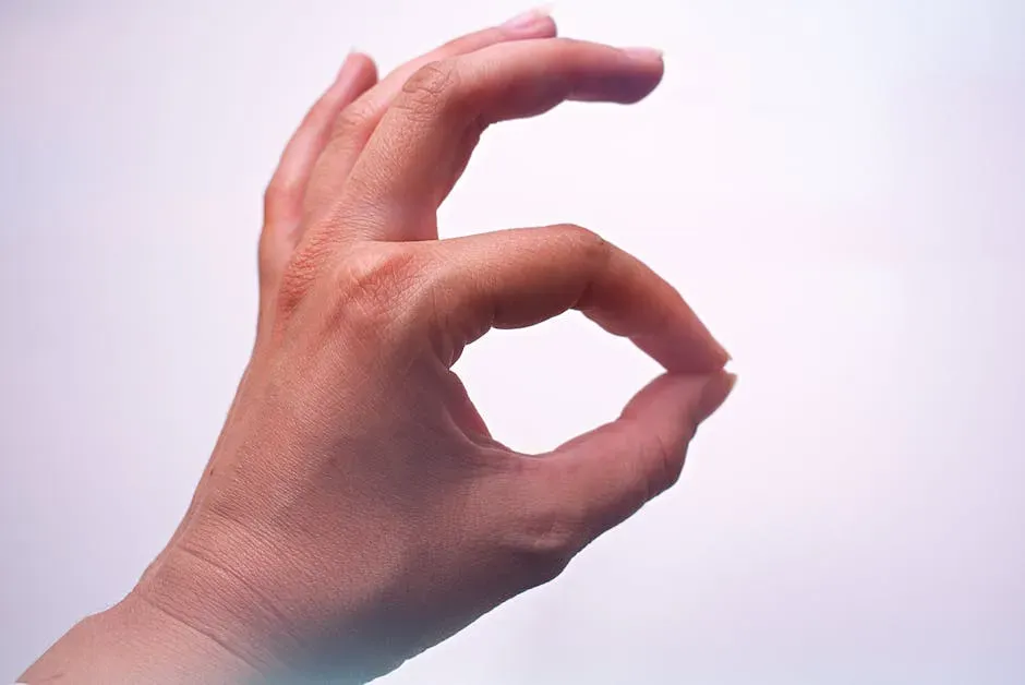 Flashing the OK Sign (Image Credits: Pexels)