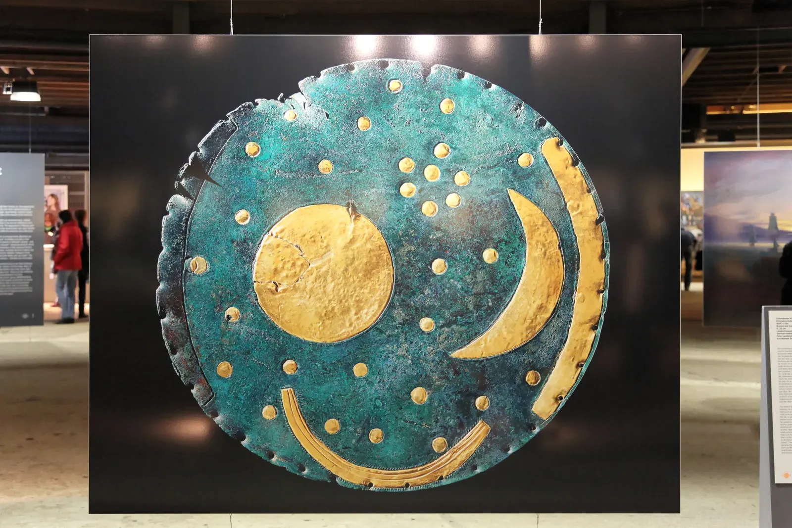 11. The Nebra Sky Disk: A Bronze Age Map of the Cosmos (By reproduction photo: Juraj Lipták exhibition photo: Frank Vincentz, Public domain)