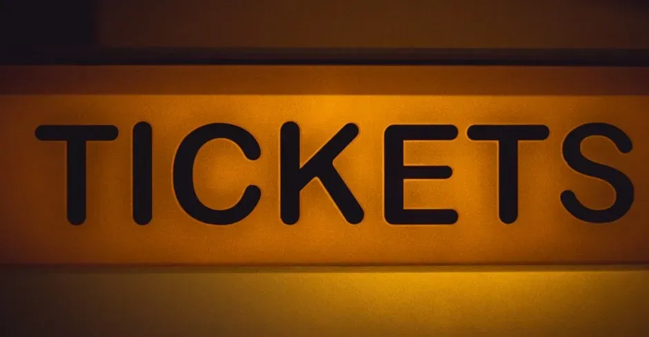 3. Charging real money for tickets and merch (Image Credits: Pexels)