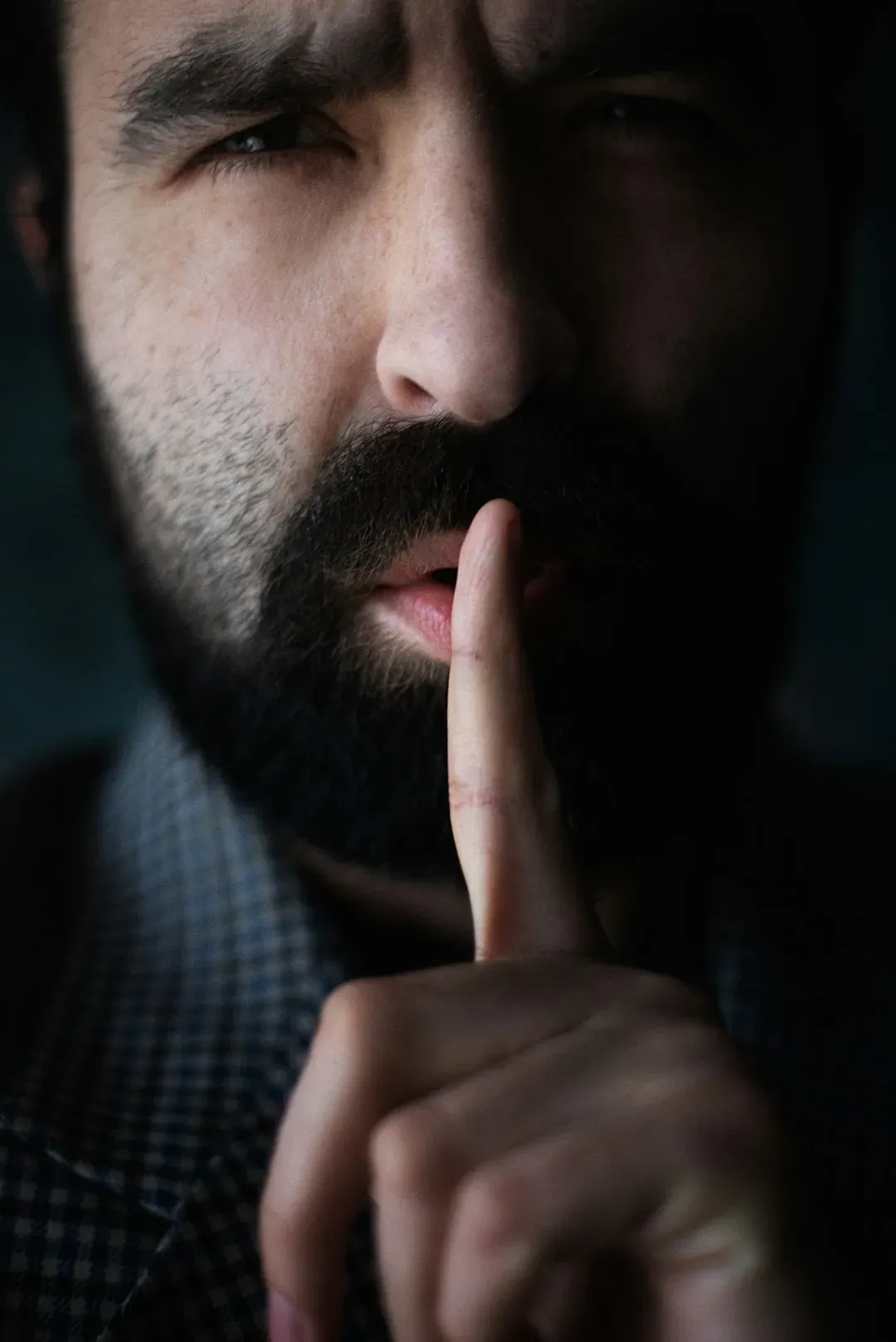 Clasped Hands and the Finger to the Lips - Grief, Secrecy, and Hidden Knowledge (Image Credits: Unsplash)