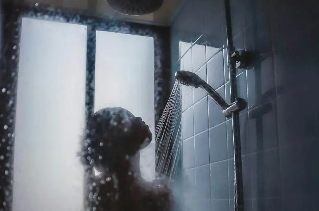 Still Six: A Woman in a Shower, Seen From Above (Image Credits: Unsplash)