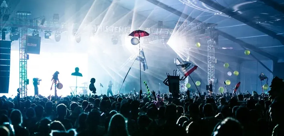 Throwing objects toward the stage (Image Credits: Pexels)