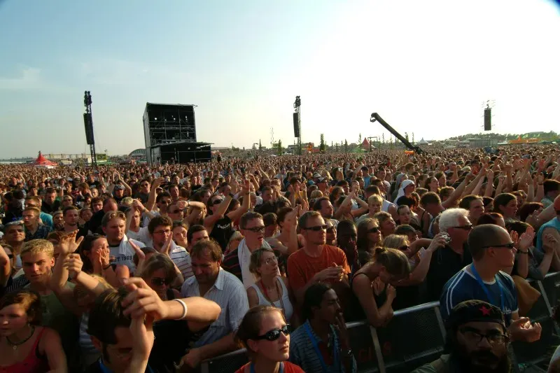 5. Having a Full Conversation During the Performance (Audience during show finale, CC BY-SA 2.0)