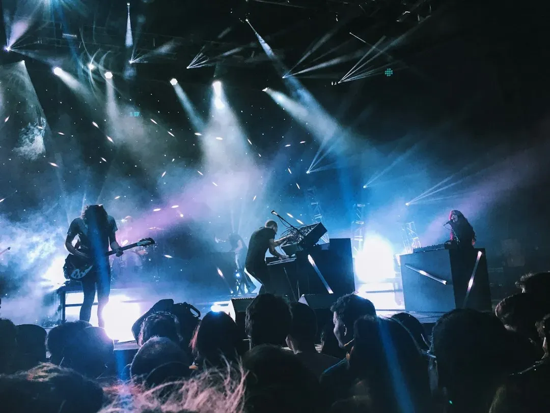 Live performance carries an energy film cannot fully replicate (Image Credits: Unsplash)