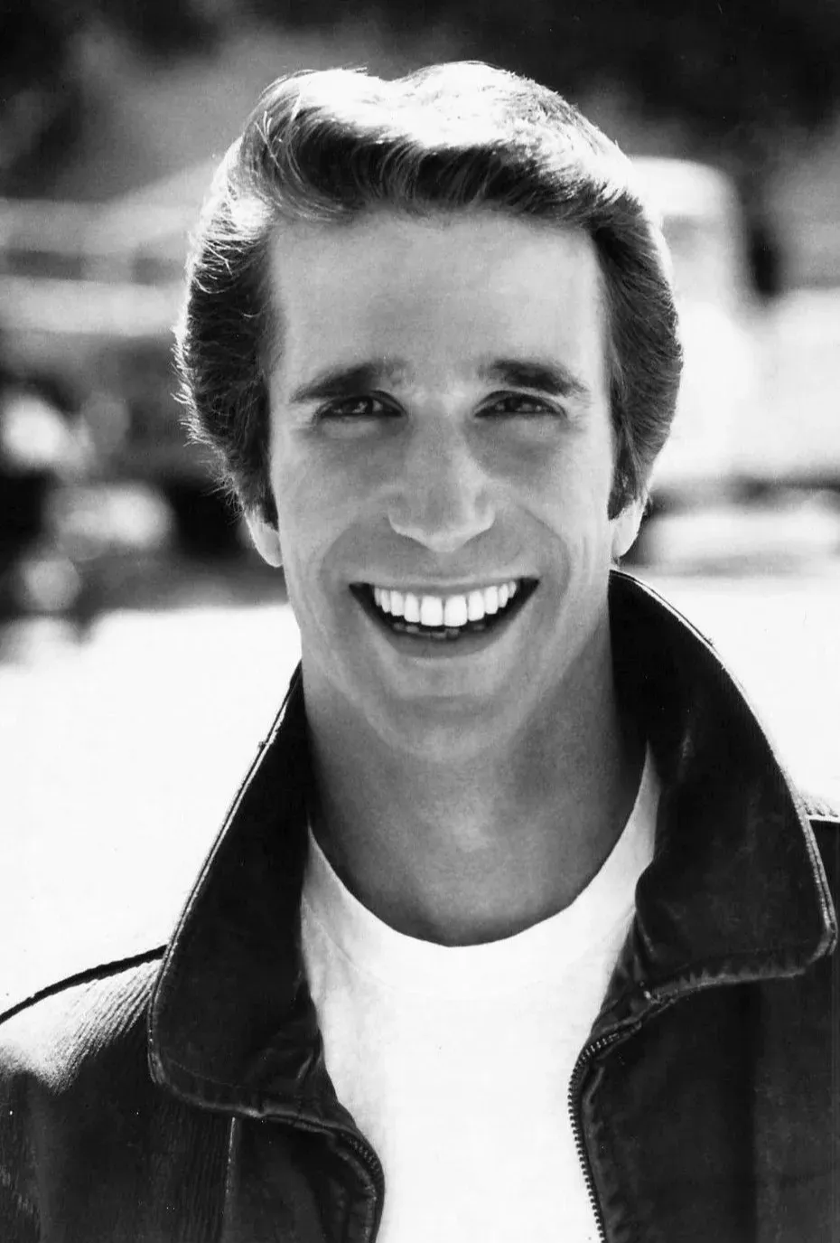 Henry Winkler - Danny Zuko in Grease (1978) (eBay item
photo front
photo back, Public domain)
