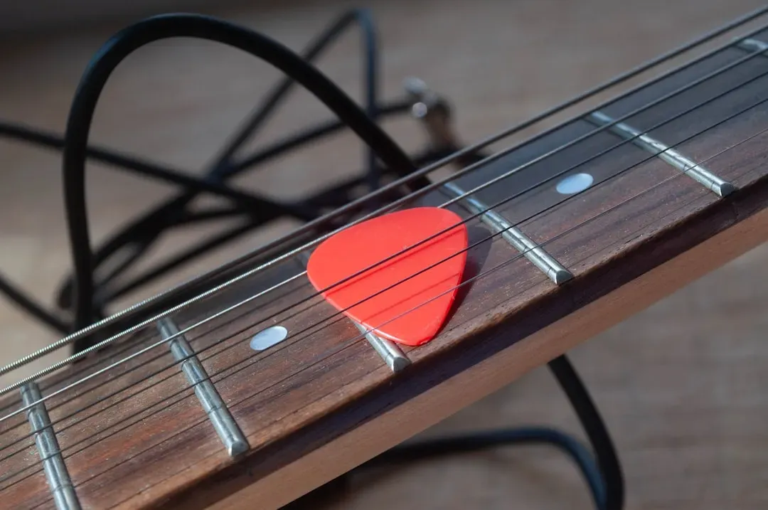 Tossing Guitar Picks: Rick Nielsen and a Handful of Cheap Trick (Image Credits: Unsplash)