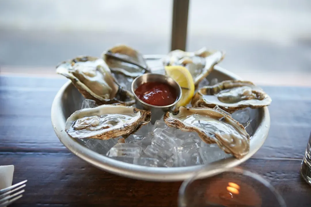 3. Raw Oysters - A Beautiful Risk That Can Go Very Wrong (Image Credits: Unsplash)