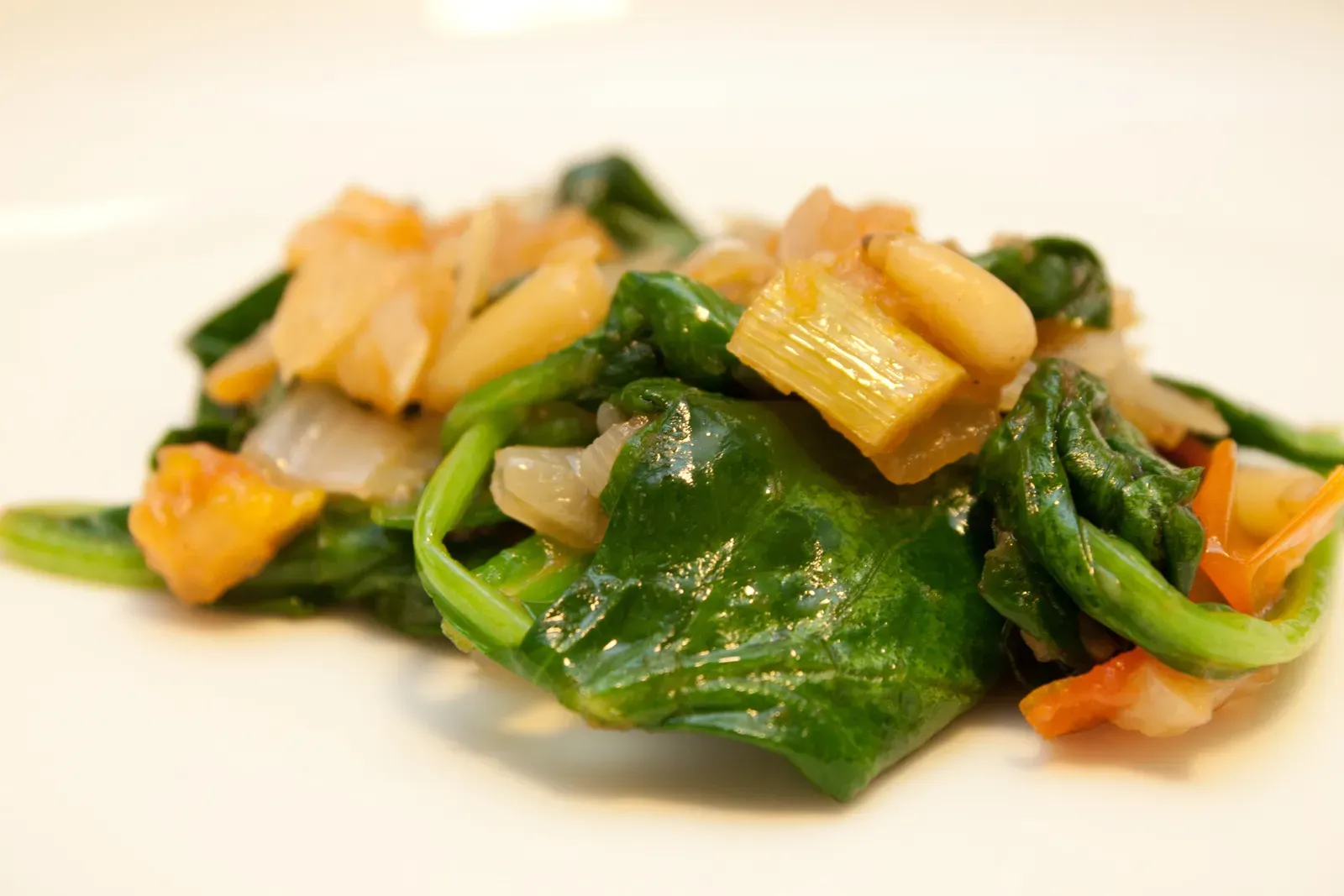 Vulnerable Groups Face Greater Risks (Sauteed spinach and tomatoes, CC BY 2.0)