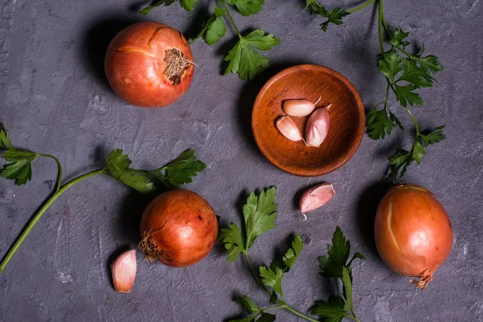 4. Adding Garlic and Onions to the Pan at the Same Time (Image Credits: Pexels)