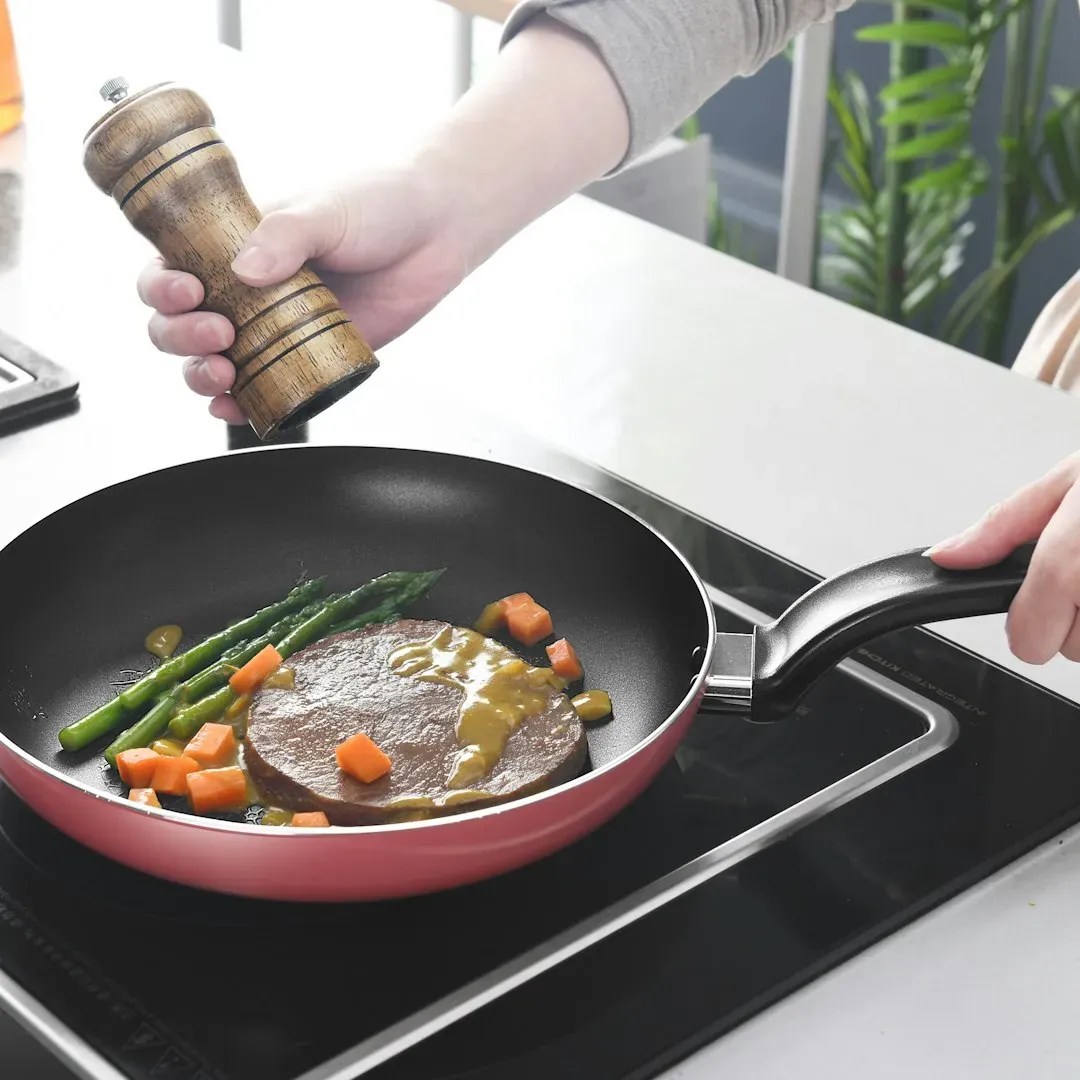 8. Shaking the Pan to Look Like a Chef on TV (Image Credits: Unsplash)