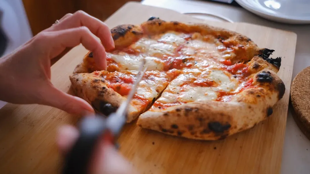 14. Artisanal Sourdough Pizza vs. Traditional Pizza (Image Credits: Unsplash)
