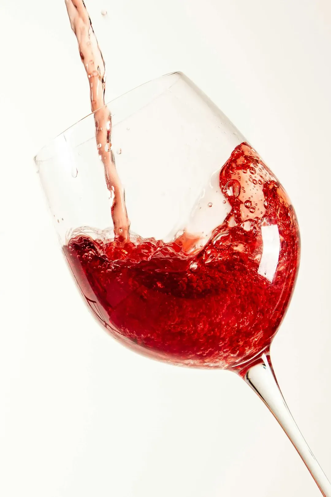 10. Pouring wine or drinks for yourself before the toast (Image Credits: Unsplash)