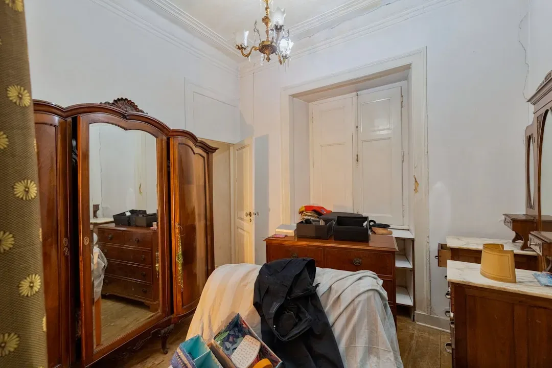 11. Mirrored or high-gloss furniture in busy rooms (Image Credits: Unsplash)