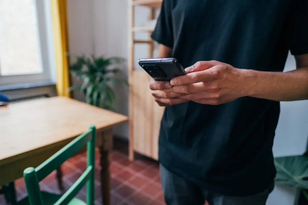 7. Texting under the table "quietly" (Image Credits: Unsplash)