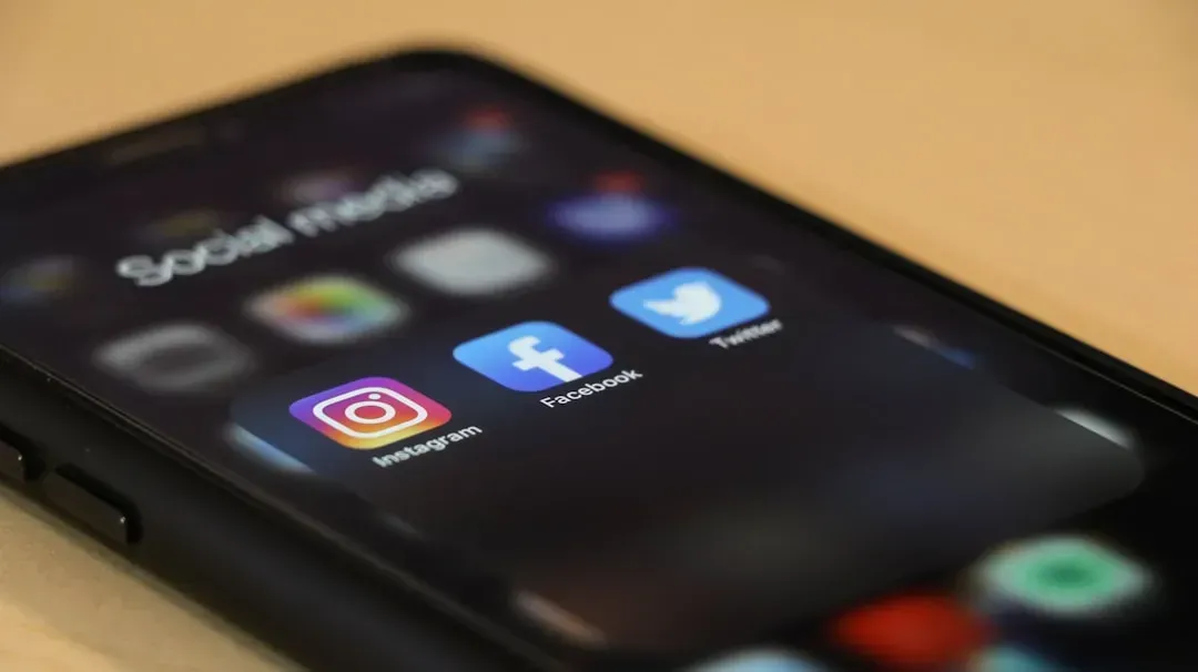 2. Scrolling Through Social Media Mid-Conversation (Image Credits: Unsplash)
