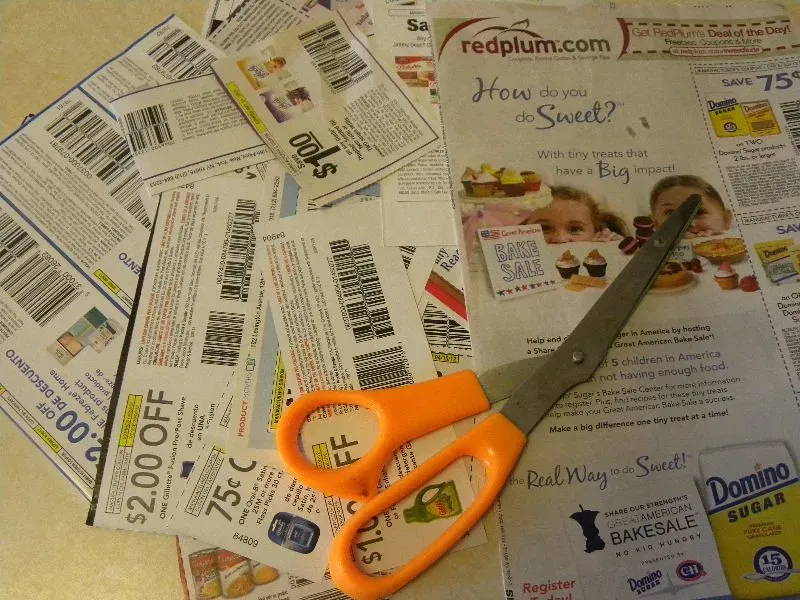 4. Clipping Coupons from the Sunday Paper (Hobbies on a Budget, Flickr, <a href="https://creativecommons.org/licenses/by/2.0/" target="_blank" rel="noopener">CC BY 2.0</a>)