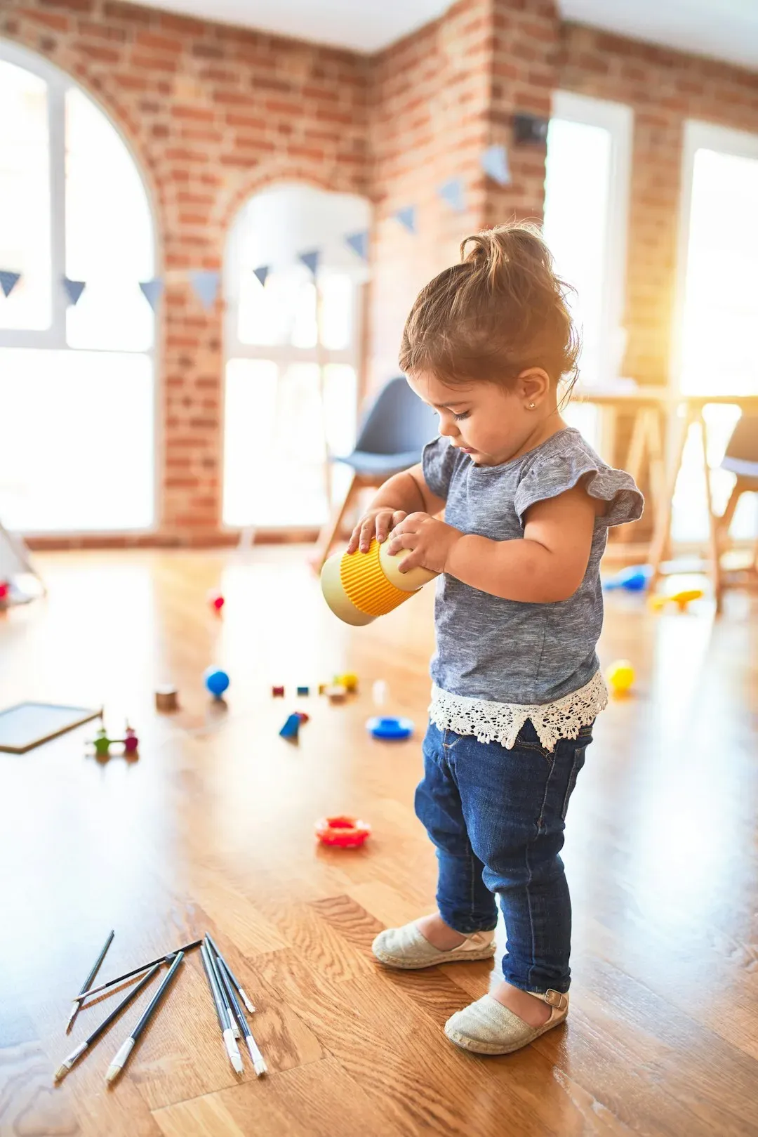 1. Putting Away Toys (Ages 2 to 3) (Image Credits: Unsplash)