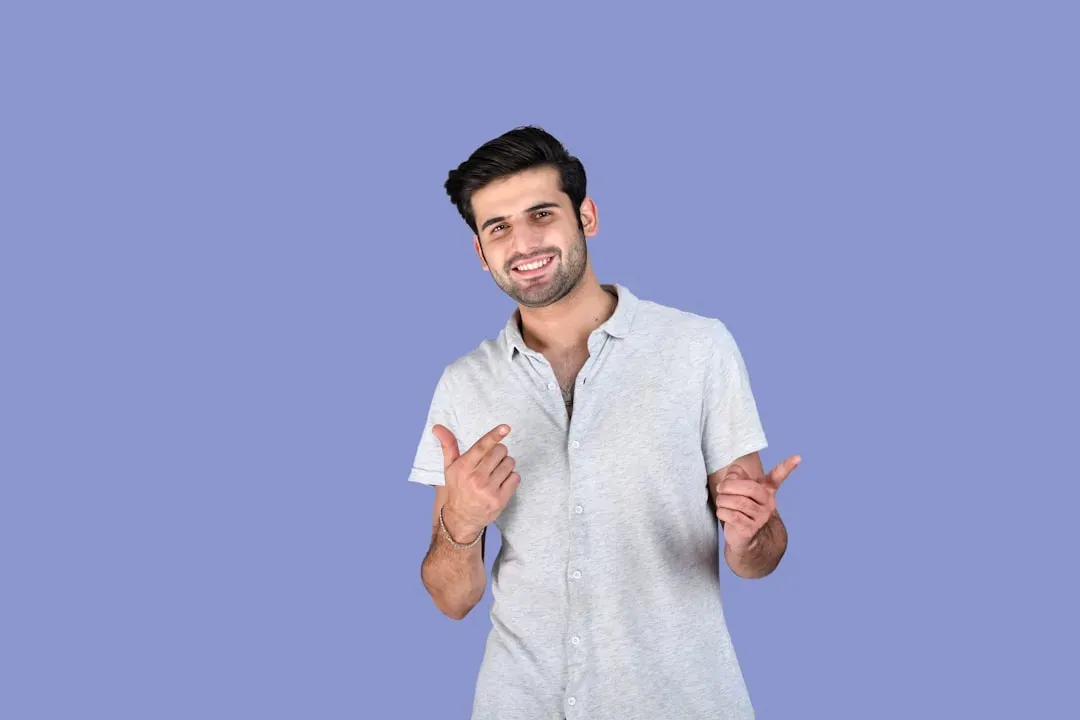He Uses Open and Expansive Body Language (Image Credits: Unsplash)