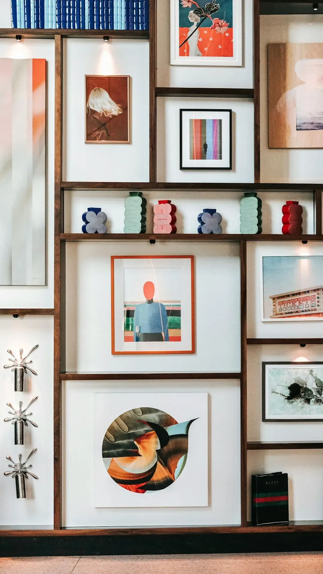 12. Gallery walls installed over built-in storage (Image Credits: Unsplash)