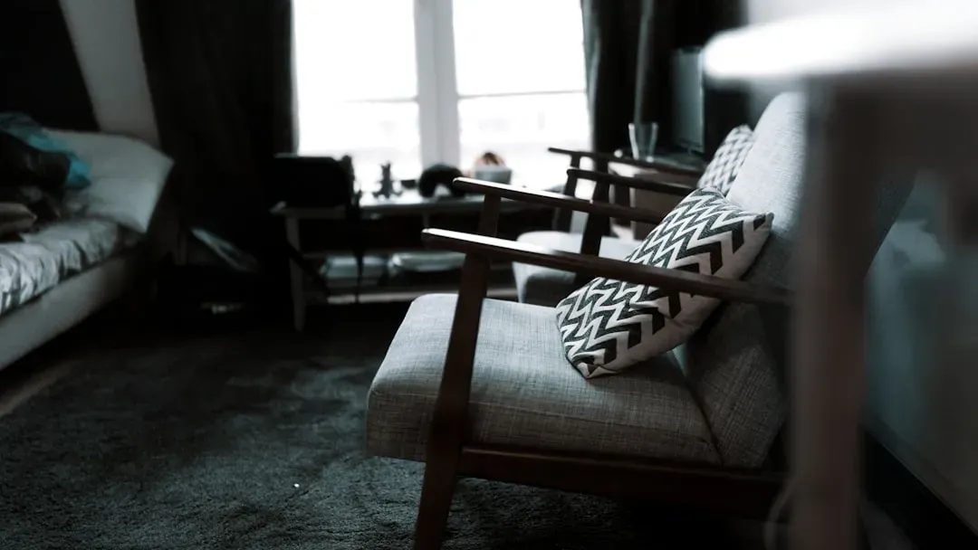 2. Anchor the Seating Area with the Right Rug (Image Credits: Unsplash)