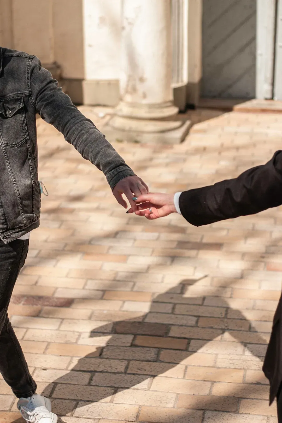 Fading Norm 4: The Firm Handshake as the Default Greeting (Image Credits: Unsplash)
